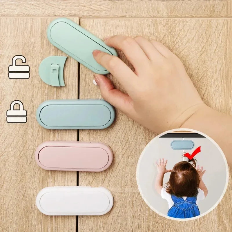 Invisible cabinet and drawer safety latch installed, hand demonstrating pinch protection
