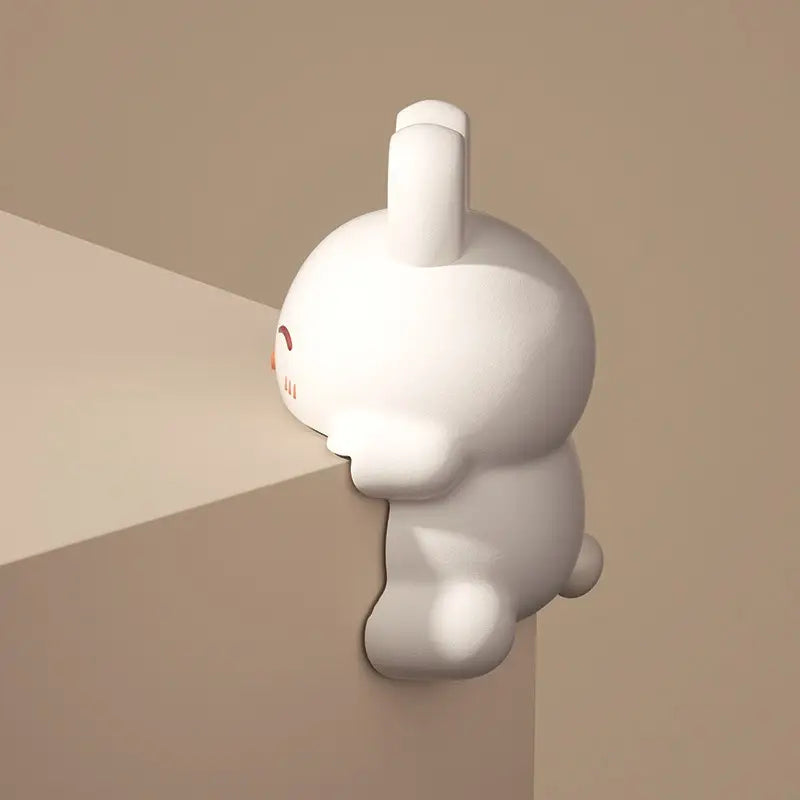 Rabbit corner protector mounted on a table corner