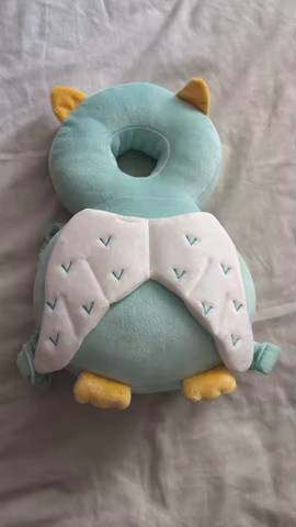 Real customer photo — dragon character PumPom Kids cushion on a play mat