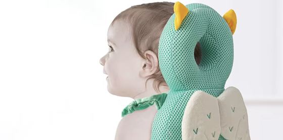 PumPom Kids anti-fall cushion shown worn by a baby